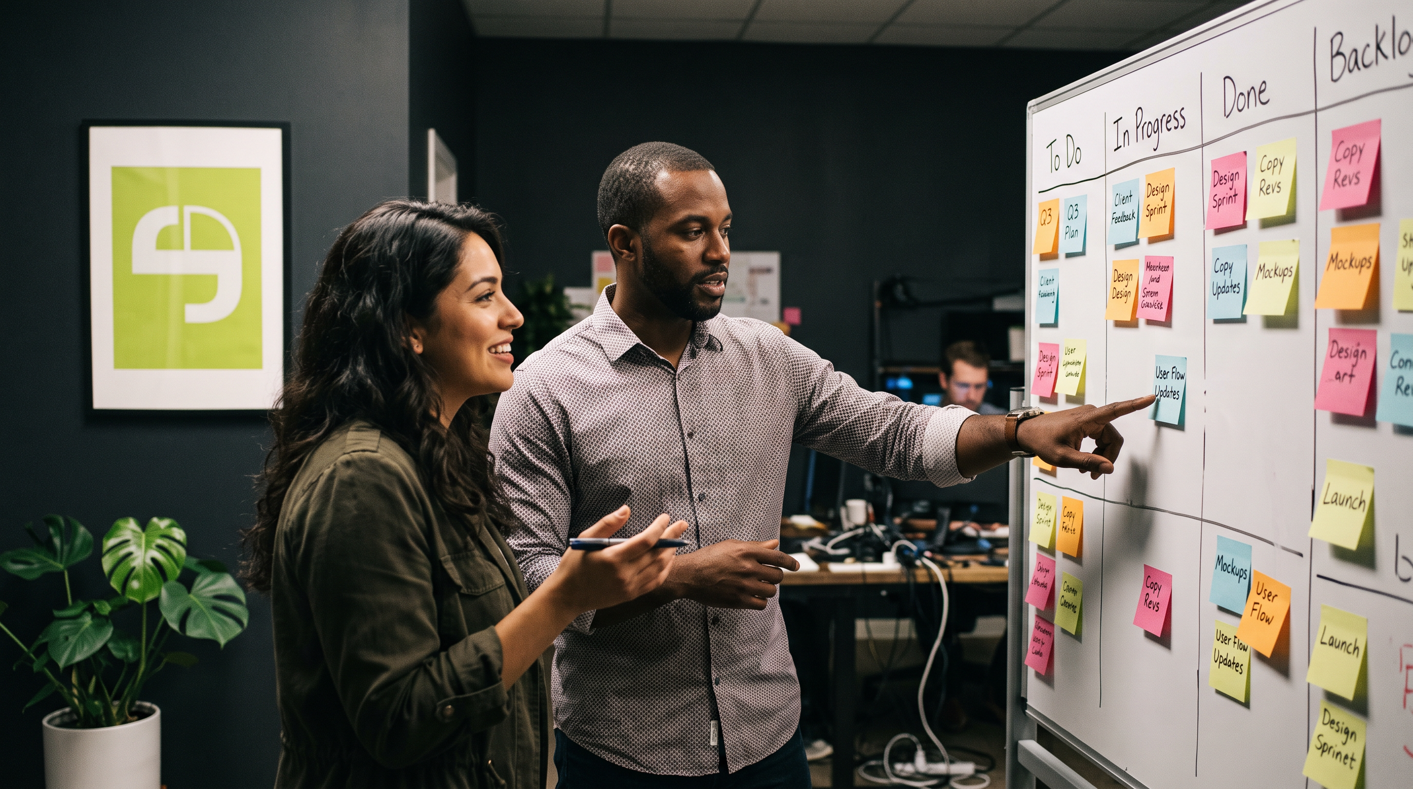 A project team collaborating over work in a studio